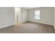 Bedroom featuring carpet flooring, a window with blinds, and neutral colored walls at 1632 Queensbridge Sq # 7, Indianapolis, IN 46219