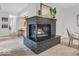 Close-up of a brick fireplace with a dark mantel, providing a cozy focal point in the living space at 1632 Queensbridge Sq # 7, Indianapolis, IN 46219