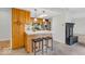 Well-equipped kitchen featuring wooden cabinets, an island with seating, and modern stainless steel appliances at 1632 Queensbridge Sq # 7, Indianapolis, IN 46219