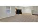 Comfortable living room featuring a black brick fireplace, carpeted floors and neutral paint at 1632 Queensbridge Sq # 7, Indianapolis, IN 46219