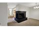 Cozy living room and fireplace combo with kitchen view at 1632 Queensbridge Sq # 7, Indianapolis, IN 46219