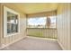 View from patio showcasing railing, wood siding, and a pleasant neighborhood setting at 1632 Queensbridge Sq # 7, Indianapolis, IN 46219