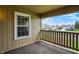 This is a view of the carpeted patio overlooking the yard and neighborhood at 1632 Queensbridge Sq # 7, Indianapolis, IN 46219