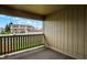 This is a view of the carpeted patio with a wooden fence and community view at 1632 Queensbridge Sq # 7, Indianapolis, IN 46219