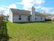 The large backyard offers ample green space and the home has vinyl siding at 1643 Kayla Dr, Indianapolis, IN 46234