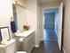 Clean bathroom featuring a vanity, toilet, and an open doorway to another room at 1643 Kayla Dr, Indianapolis, IN 46234