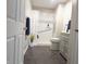 Well-maintained bathroom with a tiled floor, vanity, and a shower with a curtain at 1643 Kayla Dr, Indianapolis, IN 46234