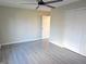Bright bedroom featuring a ceiling fan, natural light from the window and wood-look floors at 1643 Kayla Dr, Indianapolis, IN 46234