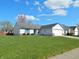 Well-kept single-story home featuring an attached garage, tidy landscaping, and a spacious front lawn at 1643 Kayla Dr, Indianapolis, IN 46234
