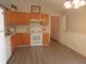 Functional kitchen with wooden cabinets, modern appliances, and views into other areas of the home at 1643 Kayla Dr, Indianapolis, IN 46234