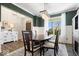 Elegant dining room with wood table, chandelier, and large window offering natural light at 16688 Bowesmont Dr, Fortville, IN 46040