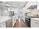 Bright kitchen features stainless steel appliances, a center island, and an open layout for easy entertaining at 16688 Bowesmont Dr, Fortville, IN 46040