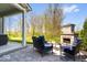 Charming outdoor fireplace with cozy seating area for enjoying evenings by the fire at 16688 Bowesmont Dr, Fortville, IN 46040
