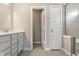 Stylish bathroom featuring a vanity with quartz countertop and modern fixtures, next to tiled shower at 17372 Graley Pl, Westfield, IN 46074