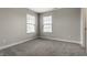 Bedroom featuring carpet, two windows with blinds, and neutral walls at 17372 Graley Pl, Westfield, IN 46074