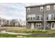 Townhome featuring a private balcony, outdoor access, and well-maintained landscaping at 17372 Graley Pl, Westfield, IN 46074