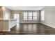 Bright, open kitchen with modern appliances, granite countertops, hardwood floors, and a sliding glass door at 17372 Graley Pl, Westfield, IN 46074
