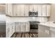 Kitchen with stainless steel appliances, white cabinets, and gas stove at 17372 Graley Pl, Westfield, IN 46074