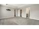 Large carpeted main bedroom with a TV mount on the wall, closet, and bathroom door at 17372 Graley Pl, Westfield, IN 46074