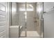 Shower boasting a glass door enclosure, sleek rainfall shower head and a built in shower bench at 17372 Graley Pl, Westfield, IN 46074