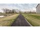 Community walking path with a pond and trees, great for outdoor activities and peaceful strolls at 17372 Graley Pl, Westfield, IN 46074