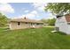 Exterior view of ranch home with a backyard storage barn and grass at 207 Stephen Ct, Indianapolis, IN 46280
