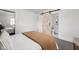 Bedroom featuring a sliding barn door to an ensuite bathroom, offering privacy and convenience at 207 Stephen Ct, Indianapolis, IN 46280