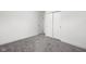 Bright bedroom featuring neutral carpet, white walls, closet, and base trim throughout at 207 Stephen Ct, Indianapolis, IN 46280