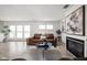 Bright living room with natural light, comfortable seating, and a modern fireplace at 207 Stephen Ct, Indianapolis, IN 46280