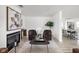 Well-designed living area with fireplace, comfortable seating, and stylish light wood floors at 207 Stephen Ct, Indianapolis, IN 46280