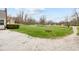Gravel driveway leading to a home with a large, grassy front yard at 218 Urban St, Danville, IN 46122