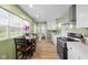 Kitchen boasts stainless steel appliances, an eat-in table, and abundant natural light at 218 Urban St, Danville, IN 46122