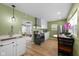 Bright kitchen featuring a black range, stainless appliances, and a nearby eat-in table at 218 Urban St, Danville, IN 46122