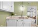 Charming kitchen showcasing updated quartz countertops, a stainless sink, and a dishwasher at 218 Urban St, Danville, IN 46122