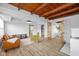 Bright, open living room featuring exposed wood ceiling beams and modern furnishings at 218 Urban St, Danville, IN 46122
