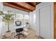 Bright home office with wooden beam ceiling, a white desk, and views from multiple windows at 218 Urban St, Danville, IN 46122