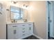 Bathroom featuring double vanity, marble countertops, modern fixtures and tiled floors at 221 Eastern Ave, Indianapolis, IN 46201