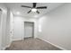 Spacious bedroom with a fan, carpet, and a closet for ample storage at 221 Eastern Ave, Indianapolis, IN 46201