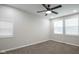 Bright bedroom with carpet, a ceiling fan, and natural light streaming through the windows at 221 Eastern Ave, Indianapolis, IN 46201