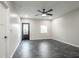 Spacious bedroom featuring tile floor, natural light and an exterior door at 221 Eastern Ave, Indianapolis, IN 46201