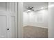 Bright bedroom featuring carpet, a ceiling fan, and natural light from the window at 221 Eastern Ave, Indianapolis, IN 46201