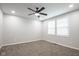 Bedroom featuring neutral walls, carpet, a ceiling fan and two windows for natural light at 221 Eastern Ave, Indianapolis, IN 46201