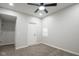 Carpeted bedroom features ceiling fan, neutral paint, and white doors at 221 Eastern Ave, Indianapolis, IN 46201
