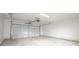 Clean, well-lit garage interior with concrete floor and an automatic garage door opener at 221 Eastern Ave, Indianapolis, IN 46201