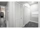 Hallway view of the home's interior with a tiled floor and white doors at 221 Eastern Ave, Indianapolis, IN 46201