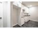 Bright kitchen features updated cabinets, granite countertops, tile backsplash and marble-look flooring at 221 Eastern Ave, Indianapolis, IN 46201