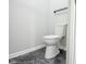 Close up of a white toilet at 221 Eastern Ave, Indianapolis, IN 46201