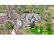 Aerial view of estate featuring mature trees, lush landscaping, and circular driveway at 23219 Marin Dr, Cicero, IN 46034