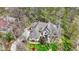 Aerial view of a large home with mature trees and lush landscaping at 23219 Marin Dr, Cicero, IN 46034