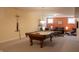 Basement rec room with a pool table and a cozy seating area with a sofa at 23219 Marin Dr, Cicero, IN 46034